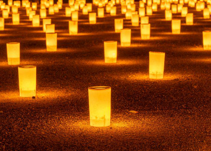 The floor is littered with glowing paper lanterns to celebrate Obon.